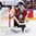 COLOGNE, GERMANY - MAY 13: Latvia's Elvis Merzlikins #30 attempts to make the save while a stick in mid-air heads towards him during preliminary round action against the U.S. at the 2017 IIHF Ice Hockey World Championship. (Photo by Andre Ringuette/HHOF-IIHF Images)

